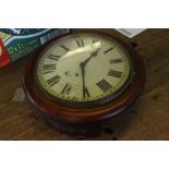 A late Victorian, mahogany cased wall clock, having enamel white dial and Roman numerals, together