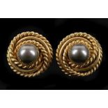 A pair of 18ct gold and pearl earrings, the dyed cultured pearl set within a rope-twist coil mount.