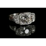 An Art Deco style platinum and diamond ring, the l