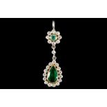 An early 20th century gold, emerald and diamond set pendant, composed of a pear shaped cluster