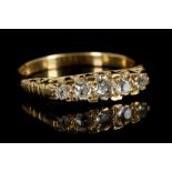 A Victorian 18ct yellow gold and diamond graduated five stone ring, the old cut stones over a