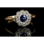 An antique 18ct yellow gold, sapphire and diamond floral cluster ring, the central mid-deep blue