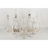 A pair of early 19th century crystal cut glass decanters and stoppers, four Edwardian hand-etched