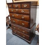 A George III chest on chest, flame mahogany, 3 over 3 graduated drawers over brushing slide and 2