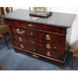 A restoration flame mahogany commode, circa 1820. The rounded grey marble top above 4 drawers with