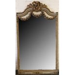 A French 19th century mirror, arch top with carved and gilded ribbon surmount, acanthus leaves and