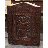 A 19th century carved corner cabinet with shaped top.