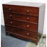 A Georgian mahogany chest of two short over 3 long graduated drawers, supported on spayed bracket