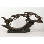 A Deco style, figural bronze group of racing dogs on rocky terrain. Unsigned, 26.5cm high x 54cm