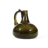 A SERVING BOTTLE, circa 1700, the onion form of green tint with a tapering neck, applied with a