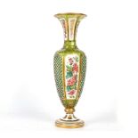 A FINE BOHEMIAN GREEN OVERLAY GLASS VASE, circa 1870-80, of baluster form with a flared rim, cased