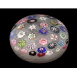 A LARGE CLICHY SPACED MILLEFIORI PAPERWEIGHT, circa 1850, inset with thirty-seven brightly