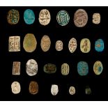 TWENTY-FOUR EGYPTIAN STEATITE AND GLAZED COMPOSITION SCARABS, PLAQUES AND SCARABOIDS Middle