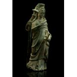 A ROMAN BRONZE FIGURE OF TYCHE-FORTUNA Circa 1st-2nd Century A.D. Wearing a long himation covering