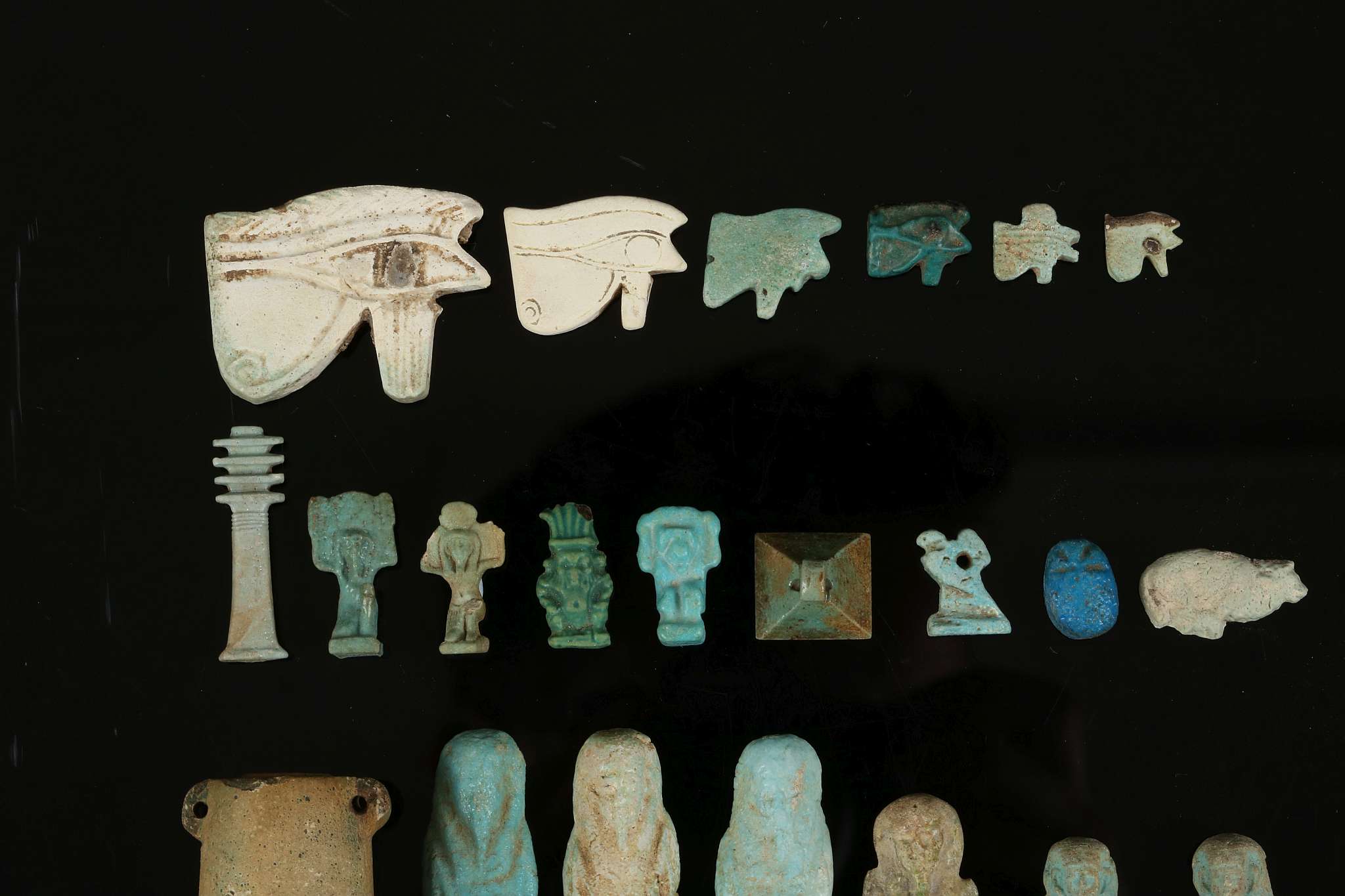 A GROUP OF EGYPTIAN GLAZED COMPOSITION AMULETS AND SHABTIS New Kingdom to Late Period, circa 1550- - Image 2 of 4
