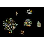 A GROUP OF ANCIENT BEADS AND GLASS FRAGMENTS Circa 6th Century B.C. to Islamic Period and later
