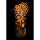 AN ATTIC RED-FIGURE HANDLE FRAGMENT Circa 5th Century B.C. Decorated with a palmette, 15.5cm long