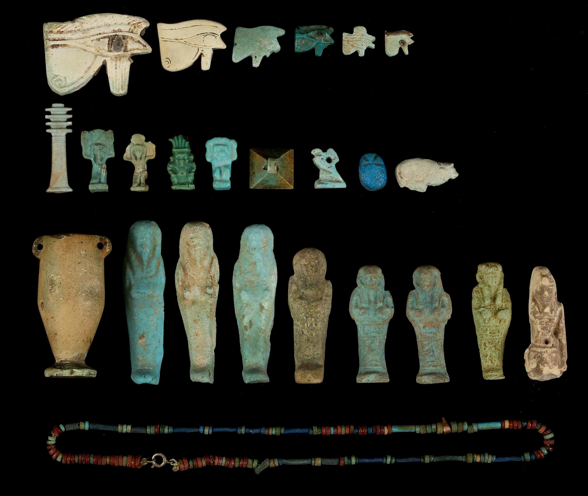 A GROUP OF EGYPTIAN GLAZED COMPOSITION AMULETS AND SHABTIS New Kingdom to Late Period, circa 1550-