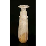 A GREEK ALABASTER ALABASTRON Circa 6th Century B.C. The elongated body tapering to the neck, with