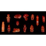 THIRTEEN EGYPTIAN HARDSTONE AMULETIC PENDANTS First Intermediate Period to Third Intermediate