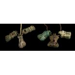 SIX ROMAN AMULETS Circa 1st Century B.C./A.D. Including three Romano-Egyptian blue glazed