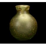 A EUROPEAN GREEN GLASS 'GREEK FIRE' HAND GRENADE Circa 16th-18th Century A.D. With thick-walled