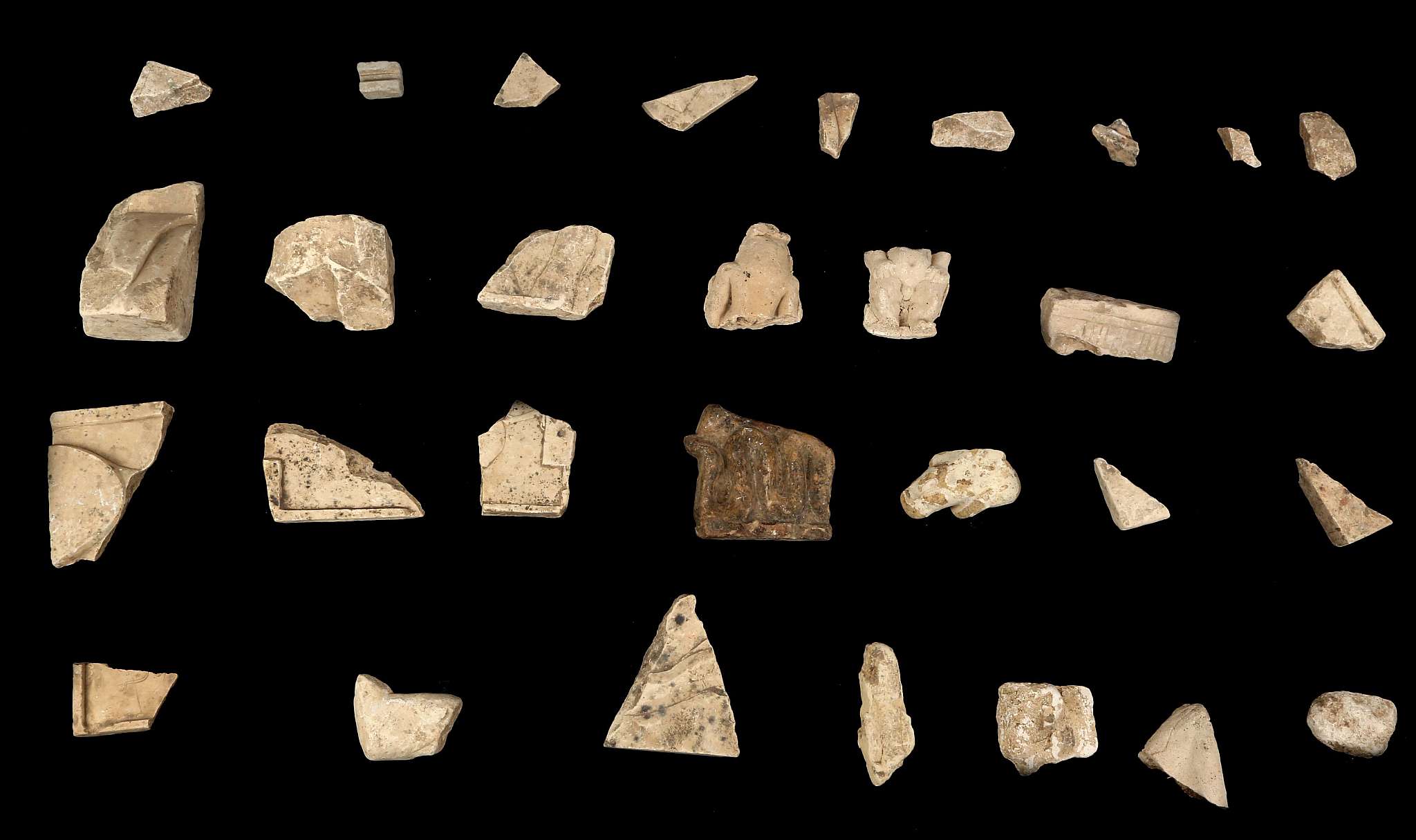 A GROUP OF EGYPTIAN LIMESTONE, SANDSTONE AND STUCCO FRAGMENTS Circa New Kingdom to Ptolemaic Period,
