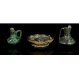 THREE GREEK BRONZE MINIATURE VESSELS Circa 6th-3rd Century B.C. Including an offering dish on raised