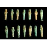 FOURTEEN EGYPTIAN GLAZED COMPOSITION SHABTIS Late Period, circa 664-332 B.C. Flat-backed, the