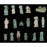 SEVENTEEN EGYPTIAN GREEN GLAZED COMPOSITION AMULETS Late Period, circa 664-332 B.C. Representing the