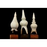 THREE WHITE GLAZED TERRACOTTA STUPA, THAILAND Circa 15th-16th Century With hemispherical body and