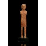 AN EGYPTIAN POLYCHROME WOOD MALE FIGURE Middle Kingdom, circa 2133-1797 B.C. Depicted standing