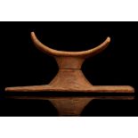 TWO EGYPTIAN WOOD HEADREST SECTIONS New Kingdom, circa 1550-1070 B.C. The curved top section and the