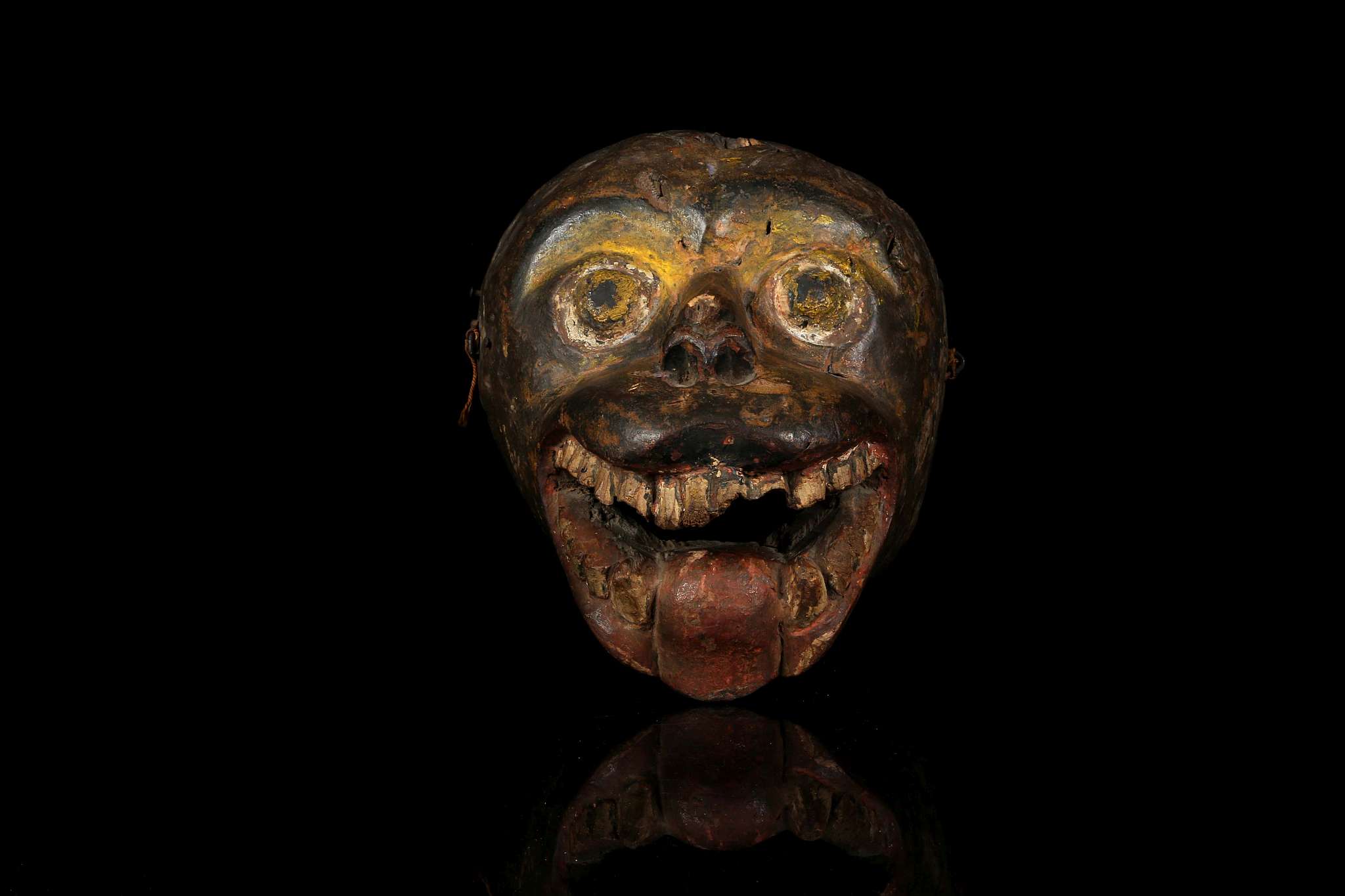 A HIMALAYAN MONKEY MASK, NEPAL With wide open round eyes, the open mouth with protruding tongue,