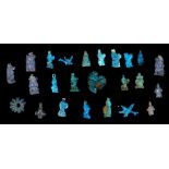 TWENTY-FOUR EGYPTIAN GLAZED COMPOSITION AMULETIC PENDANTS New Kingdom, 18th Dynasty, Amarna