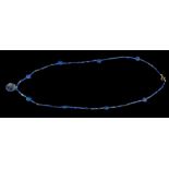 A WESTERN ASIATIC LAPIS LAZULI AND GOLD BEAD NECKLACE Circa late 3rd Millennium B.C. Restrung with