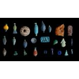 A GROUP OF EGYPTIAN GLAZED COMPOSITION AMULETS AND PENDANTS New Kingdom, circa 1550-1070 B.C.