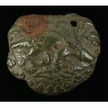 A ROMAN BRONZE MOUNT WITH HUNTING SCENE Circa 1st-2nd Century A.D. Possibly from a vessel, showing a