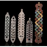 FIVE WOOD SPOON RACKS, SRI LANKA The four trays of rectangular shape, with openwork patterns to hold