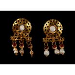 A PAIR OF ROMAN GOLD, PEARL AND GARNET EARRINGS Circa 3rd Century A.D. Each earring composed of an