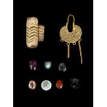 A COLLECTION OF ANCIENT JEWELLERY Circa 2nd-10th Century A.D. Seven Roman intaglios, including a