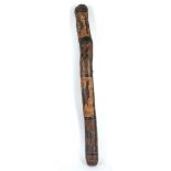 AN ABORIGINAL DIDGERIDOO, AUSTRALIA Carved with figures of animals, flowers and weapons, 89cm long