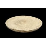 A ROMANO-EGYPTIAN LIMESTONE OFFERING TABLE Circa 1st-3rd Century A.D. Of shallow round shape, with