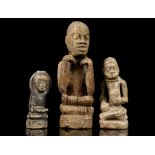 THREE BAKONGO LIMESTONE 'NTADI' FIGURES, DEMOCRATIC REPUBLIC OF CONGO The three figures seated in