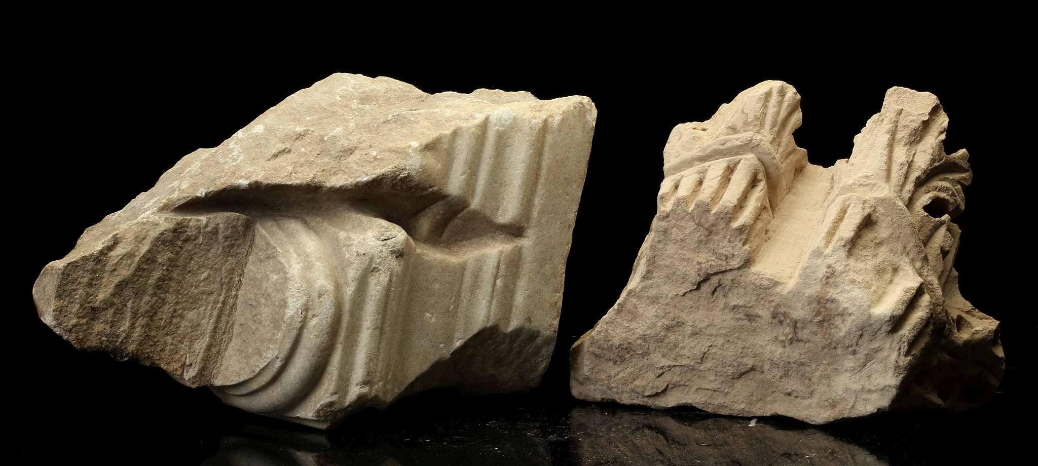 TWO ROMAN STONE FRAGMENTS Circa 2nd-3rd Century A.D. Including a limestone capital fragment,