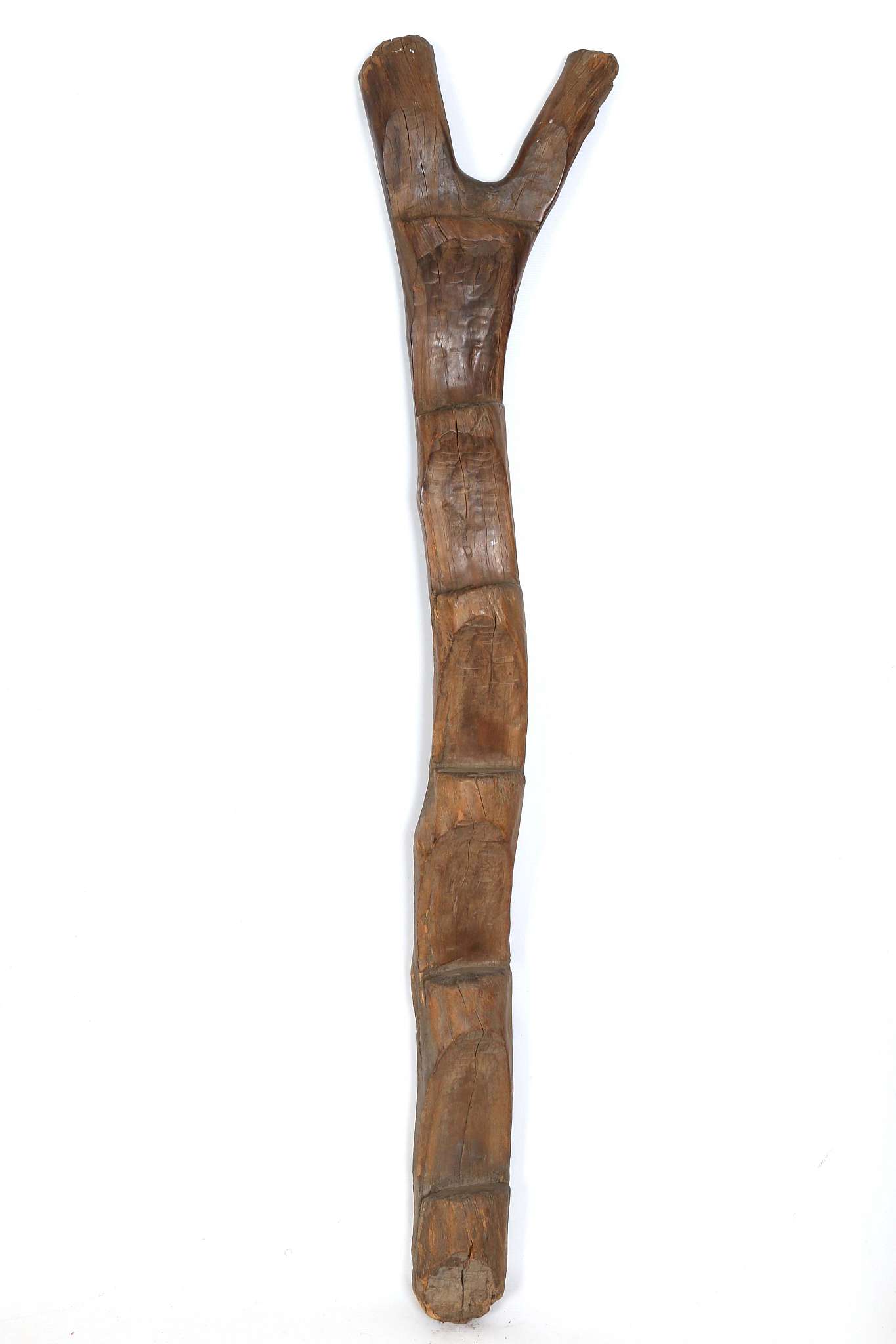 A DOGON LADDER, MALI Of typical stepped, Y-shaped form, with shiny brown patina, 163cm high