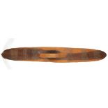 AN ABORIGINAL PARRYING SHIELD, AUSTRALIA Of typical elongated oval shape with integral handle at the
