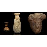 THREE MISCELLANEOUS ANTIQUITIES Circa 7th Century B.C. - 3rd Century A.D. Including an Egyptian wood