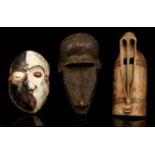 THREE AFRICAN MASKS Including a Pende 'Mbangu' distorted mask, Democratic Republic of Congo, 28cm