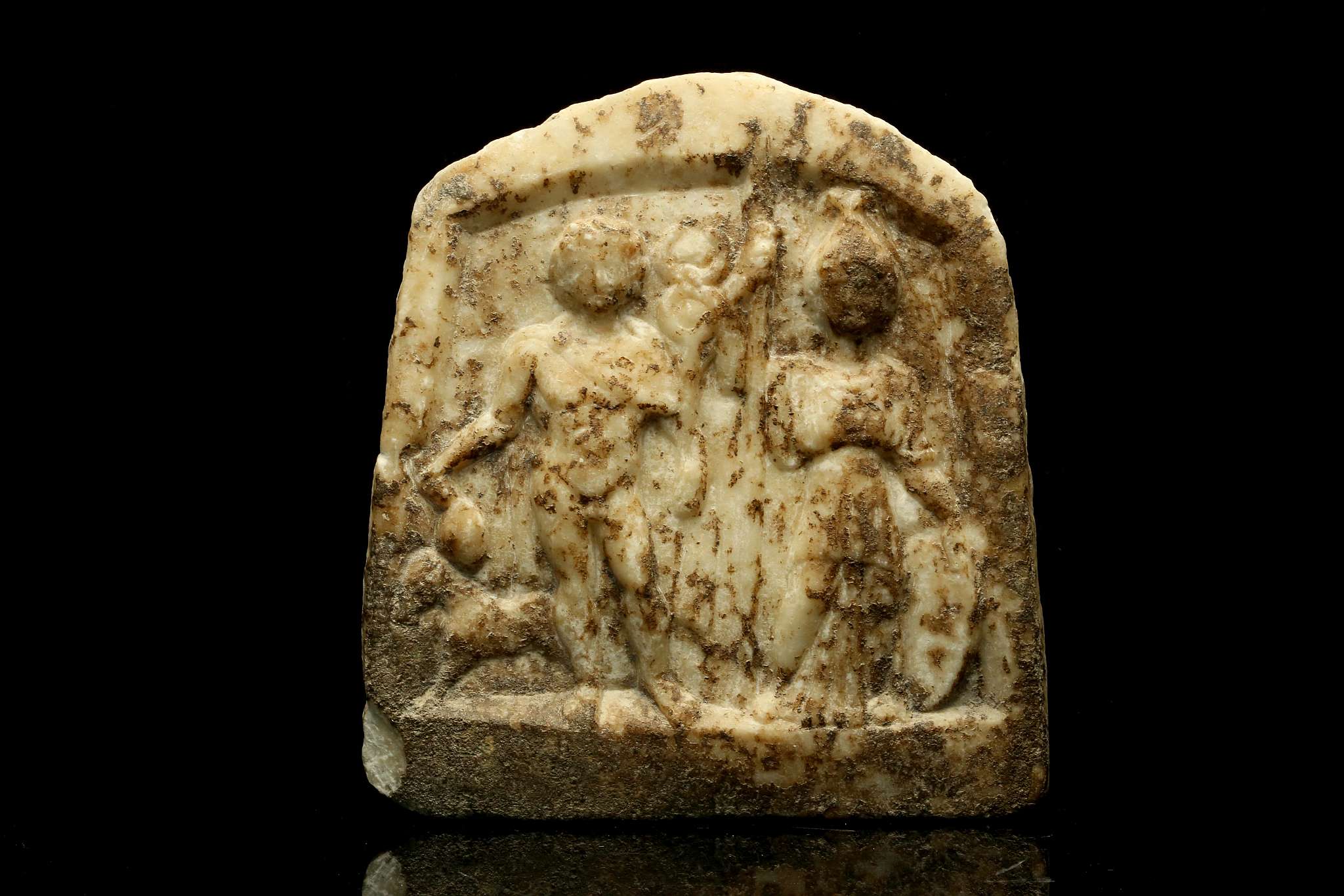 A ROMAN MARBLE STELE Circa 1st-2nd Century A.D. Carved in relief with the god Hermes, depicted